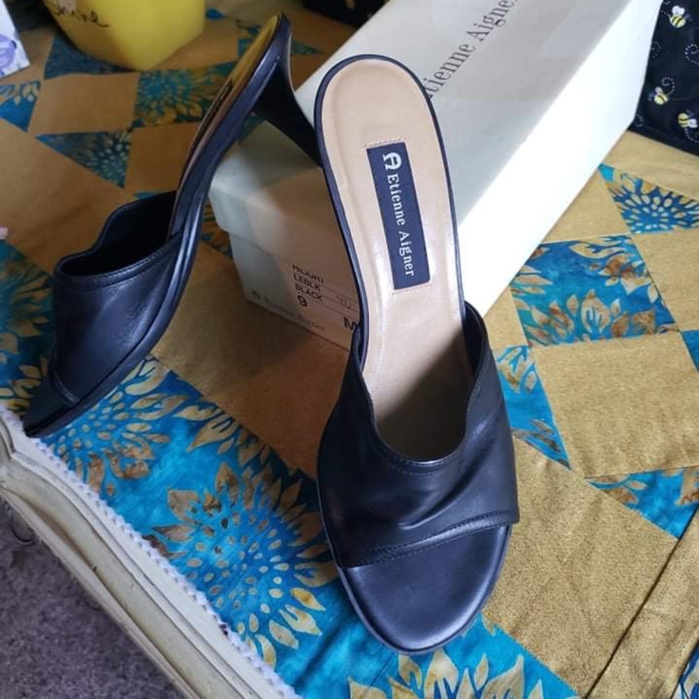 Black heeled leather slides. Etienne Aigner
